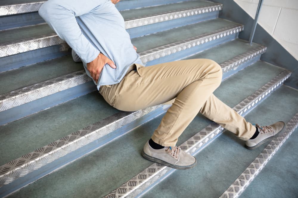 Slip and fall laws Mature Man Lying On Staircase After Slip And Fall Accident