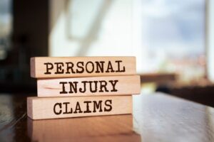 personal injury claim Wooden blocks with words 'Personal injury claims'.