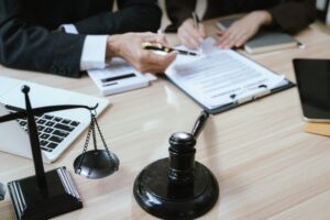 Close Up Of Male Lawyer Working With Contract Documents